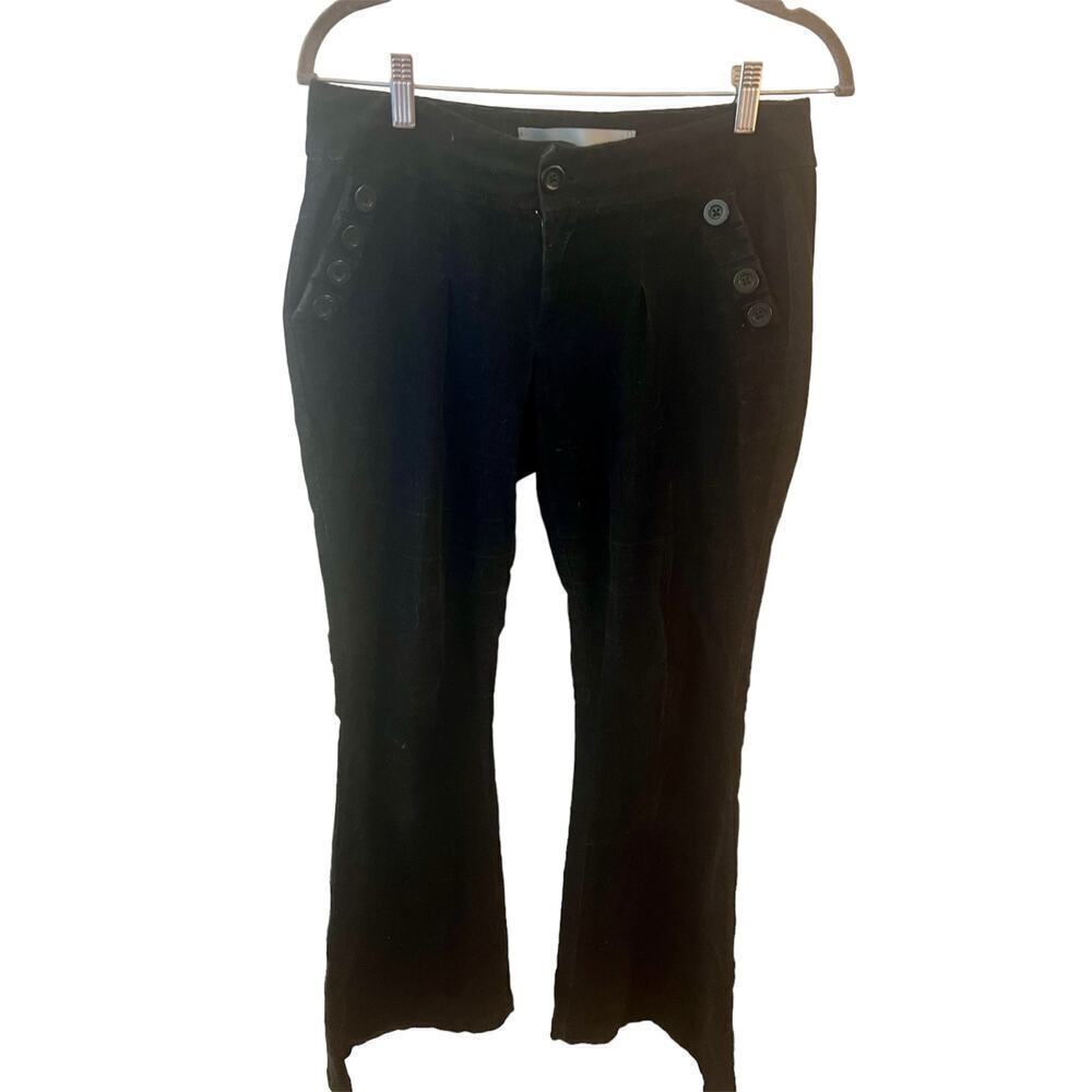 Mid rise size 10 black corduroy pants with flared legs and button accent on hips
